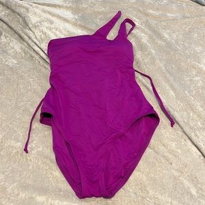 Brand new size medium, one shoulder, bathing suit